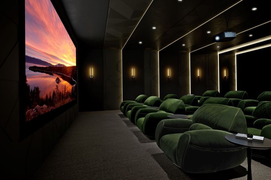 A home theater with a projector and a large screen displaying a nature scene.