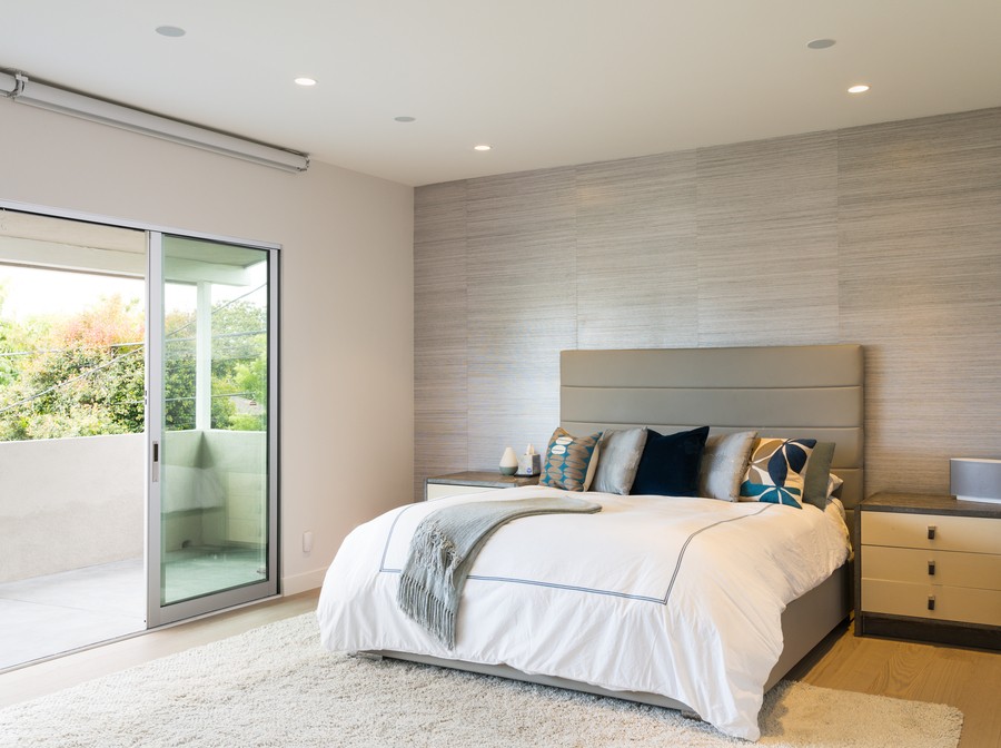 A bedroom featuring Ketra recessed lights on the ceiling.